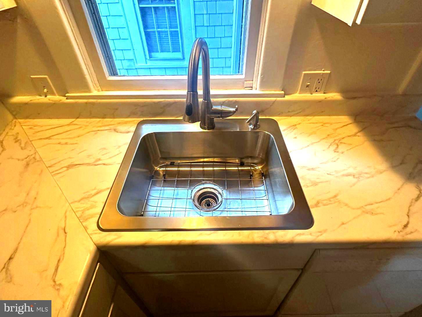 4608 West Virginia Avenue Bethesda, MD 20814 - Photo 30 of 61 a sink sitting next to a window