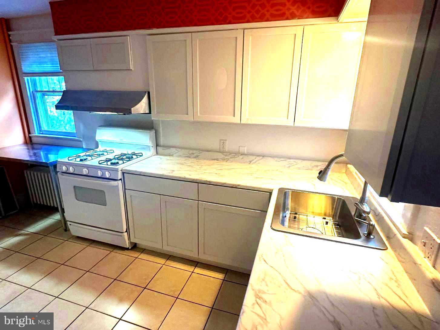 4608 West Virginia Avenue Bethesda, MD 20814 - Photo 31 of 61 a kitchen with a sink and cabinets