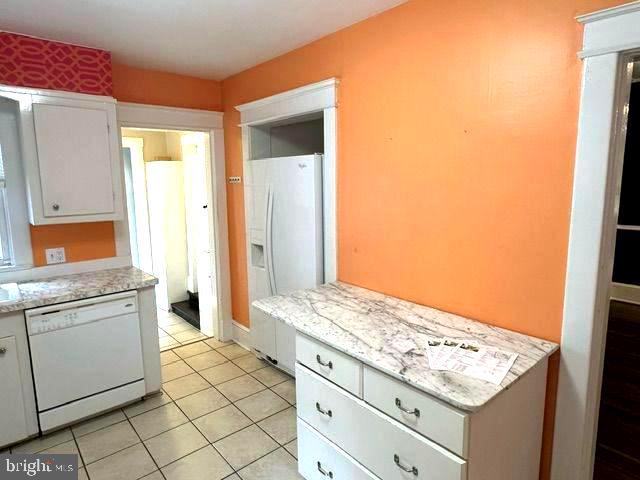 4608 West Virginia Avenue Bethesda, MD 20814 - Photo 34 of 61 a kitchen with a stove and a refrigerator