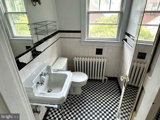 4608 West Virginia Avenue Bethesda, MD 20814 - Photo 40 of 61 a bathroom with a toilet a sink and a window