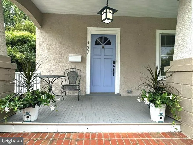 a view of living room filled with furniture and a potted plant