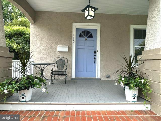 4608 West Virginia Avenue Bethesda, MD 20814 - Photo 4 of 61 a view of living room filled with furniture and a potted plant