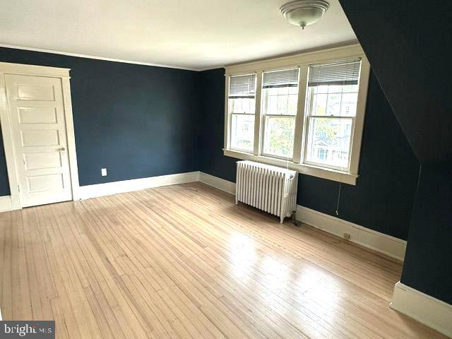 4608 West Virginia Avenue Bethesda, MD 20814 - Photo 44 of 61 an empty room with wooden floor and windows