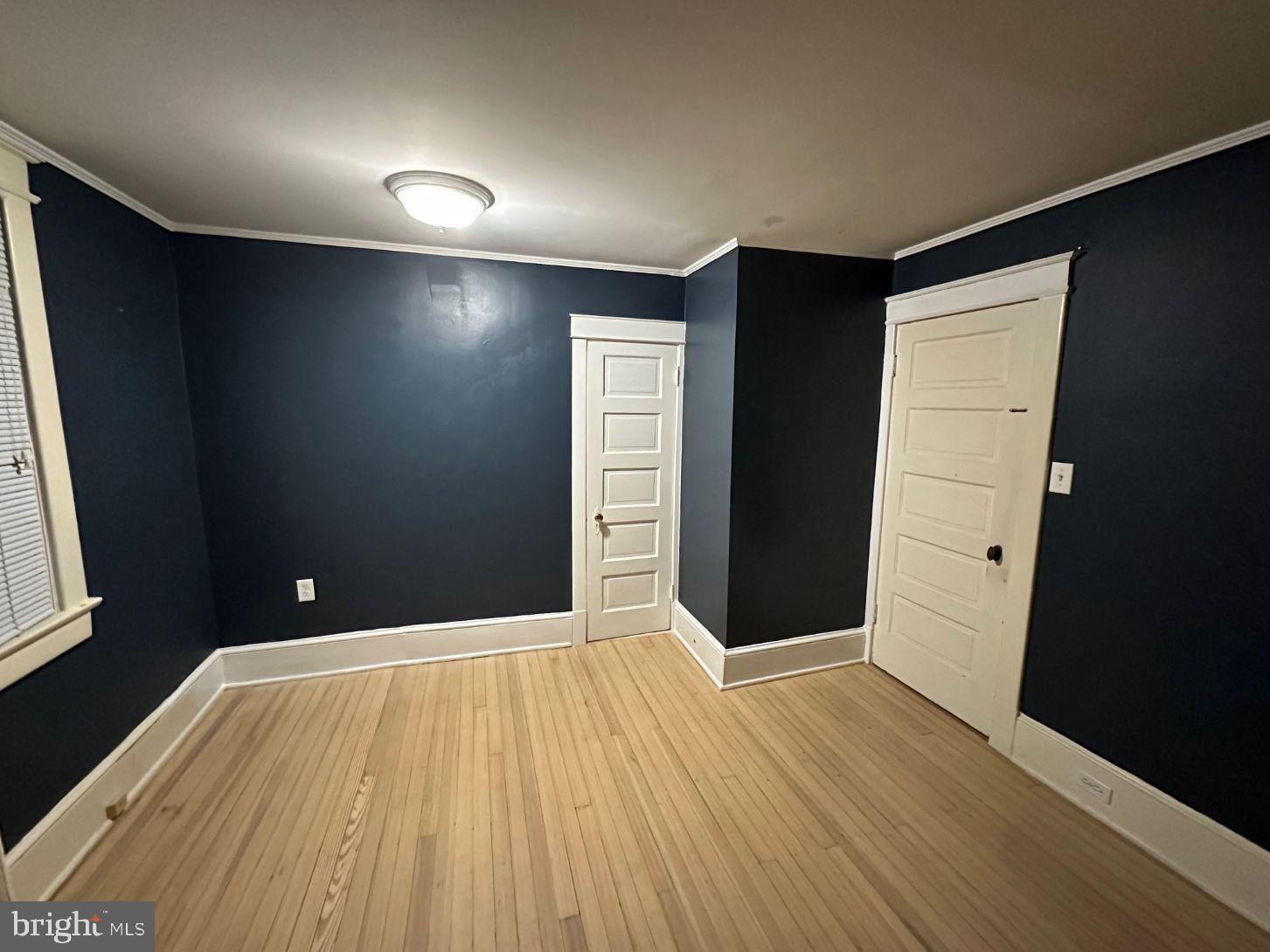 4608 West Virginia Avenue Bethesda, MD 20814 - Photo 45 of 61 wooden floor in an empty room with a window