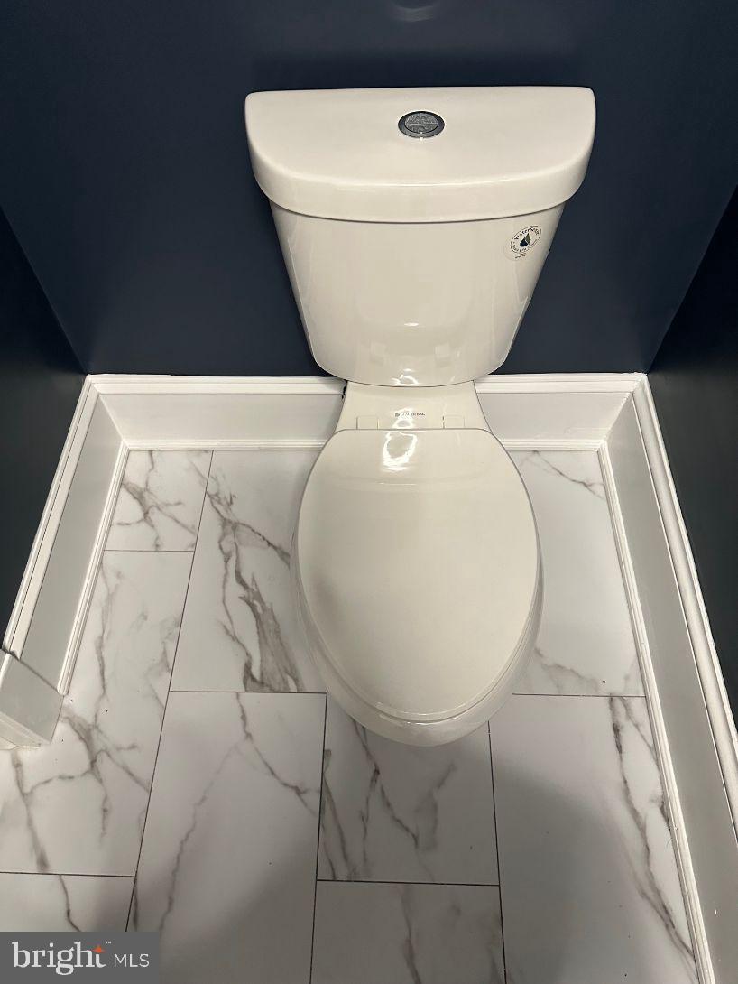 4608 West Virginia Avenue Bethesda, MD 20814 - Photo 46 of 61 a close view of a toilet in a bathroom