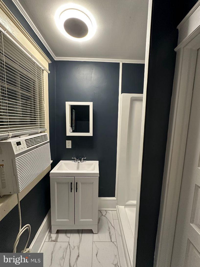 4608 West Virginia Avenue Bethesda, MD 20814 - Photo 47 of 61 a bathroom with a sink and a mirror