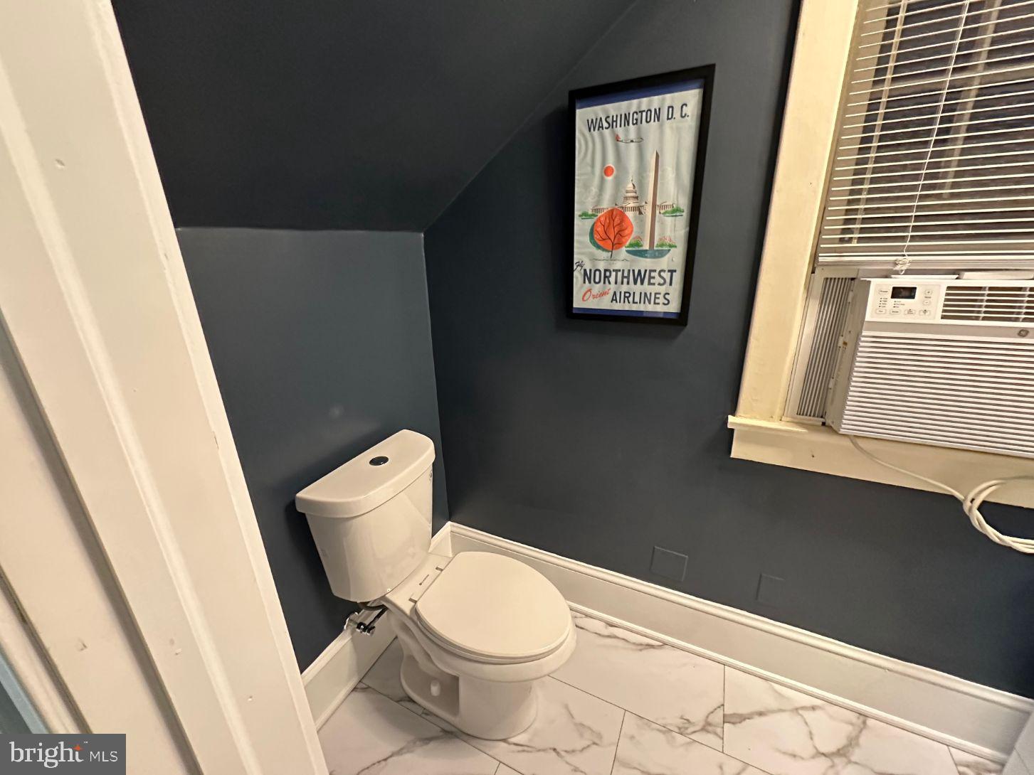 4608 West Virginia Avenue Bethesda, MD 20814 - Photo 48 of 61 a white toilet sitting next to a small sink