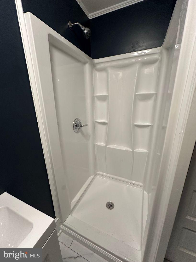 4608 West Virginia Avenue Bethesda, MD 20814 - Photo 50 of 61 a bathroom with a tub