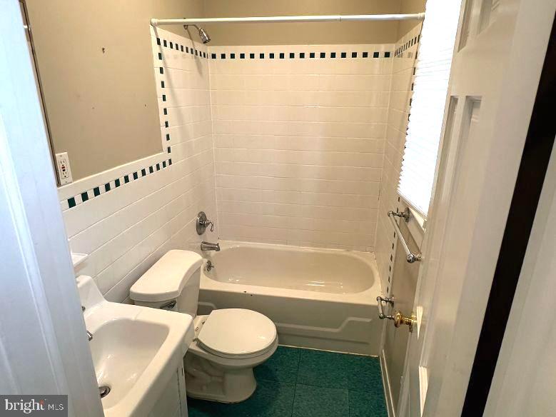 4608 West Virginia Avenue Bethesda, MD 20814 - Photo 58 of 61 a bathroom with a toilet and a shower