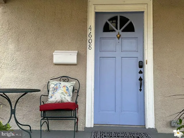 a view of a hallway with seating area