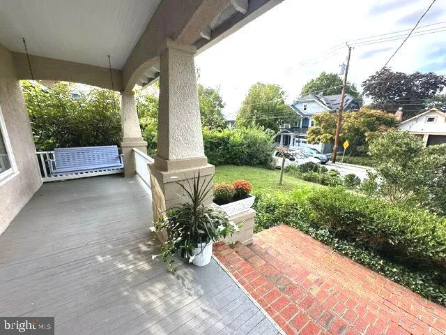 a view of a patio with chairs and a yard
