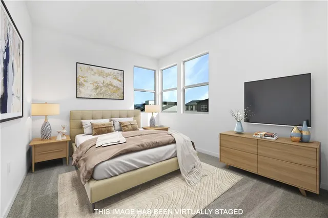 a white bath tub sitting in a bathroom next to a window