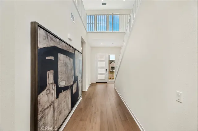 a bedroom with bed and a potted plant
