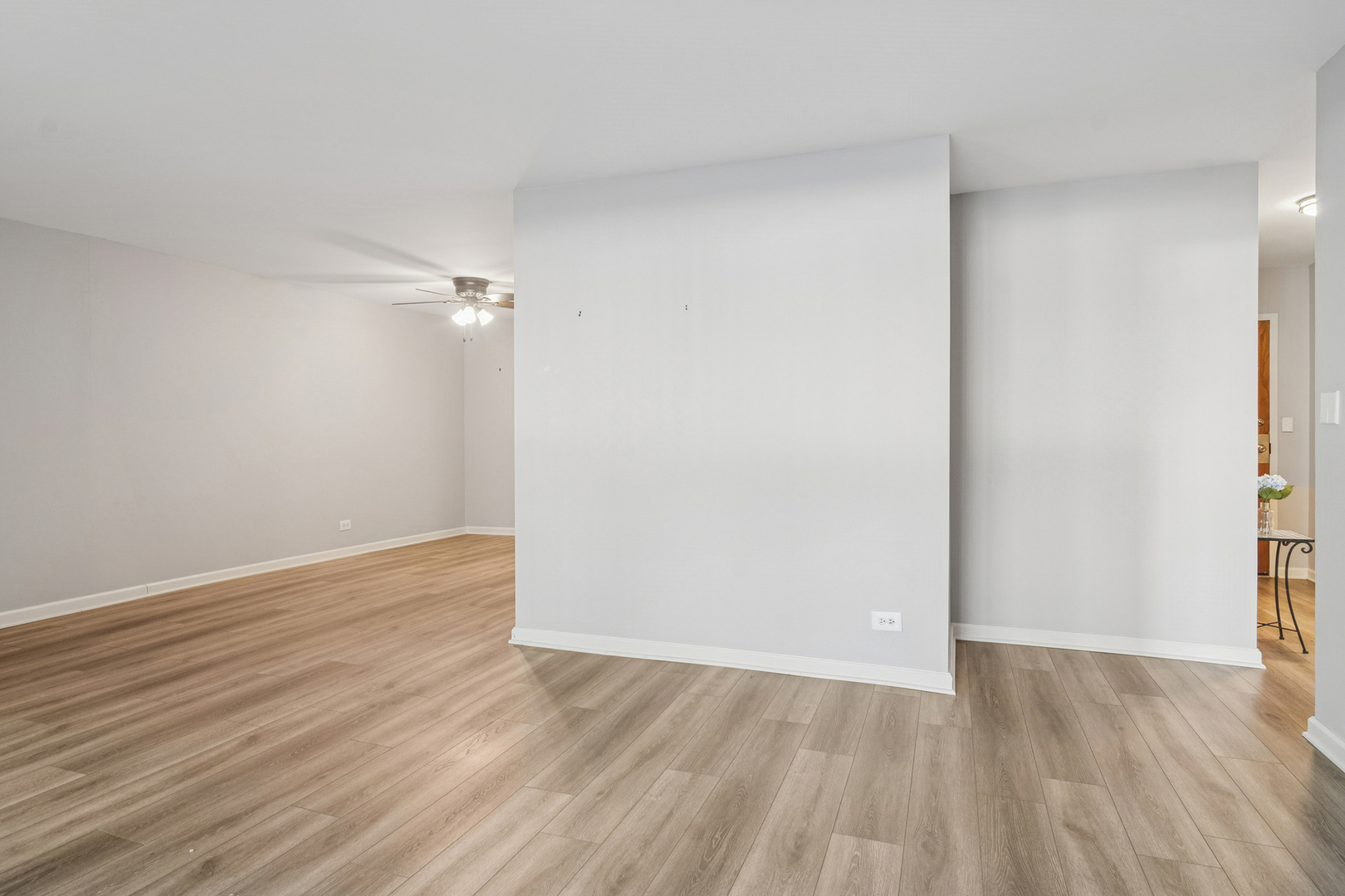 1605 East Central Road, Unit 111B Arlington Heights, IL 60005 - Photo 13 of 26 a view of an empty room with wooden floor