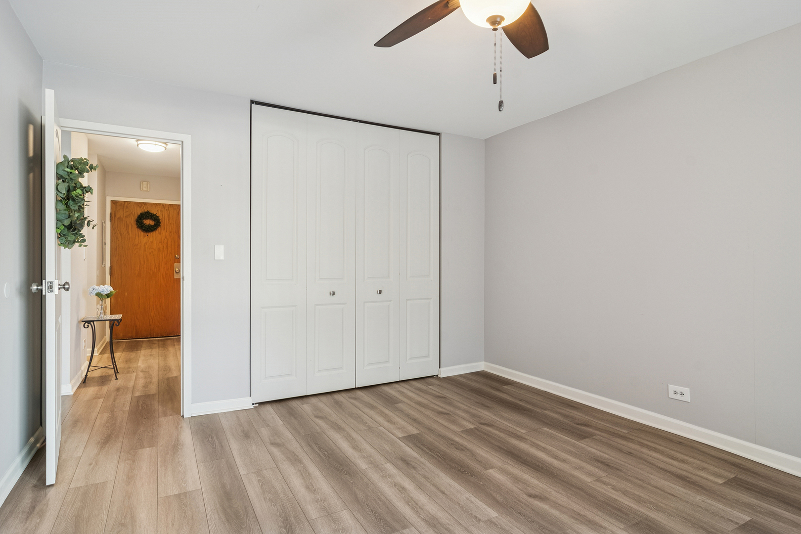 1605 East Central Road, Unit 111B Arlington Heights, IL 60005 - Photo 15 of 26 a view of empty room with wooden floor