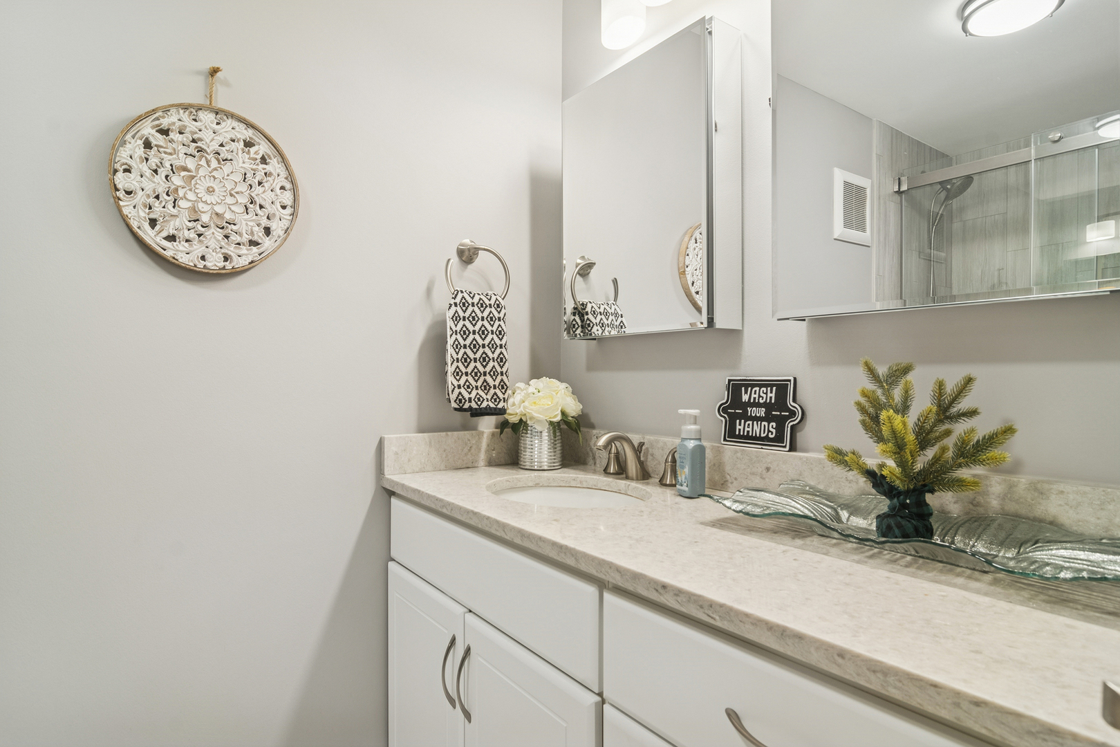 1605 East Central Road, Unit 111B Arlington Heights, IL 60005 - Photo 18 of 26 a bathroom with a sink and a mirror