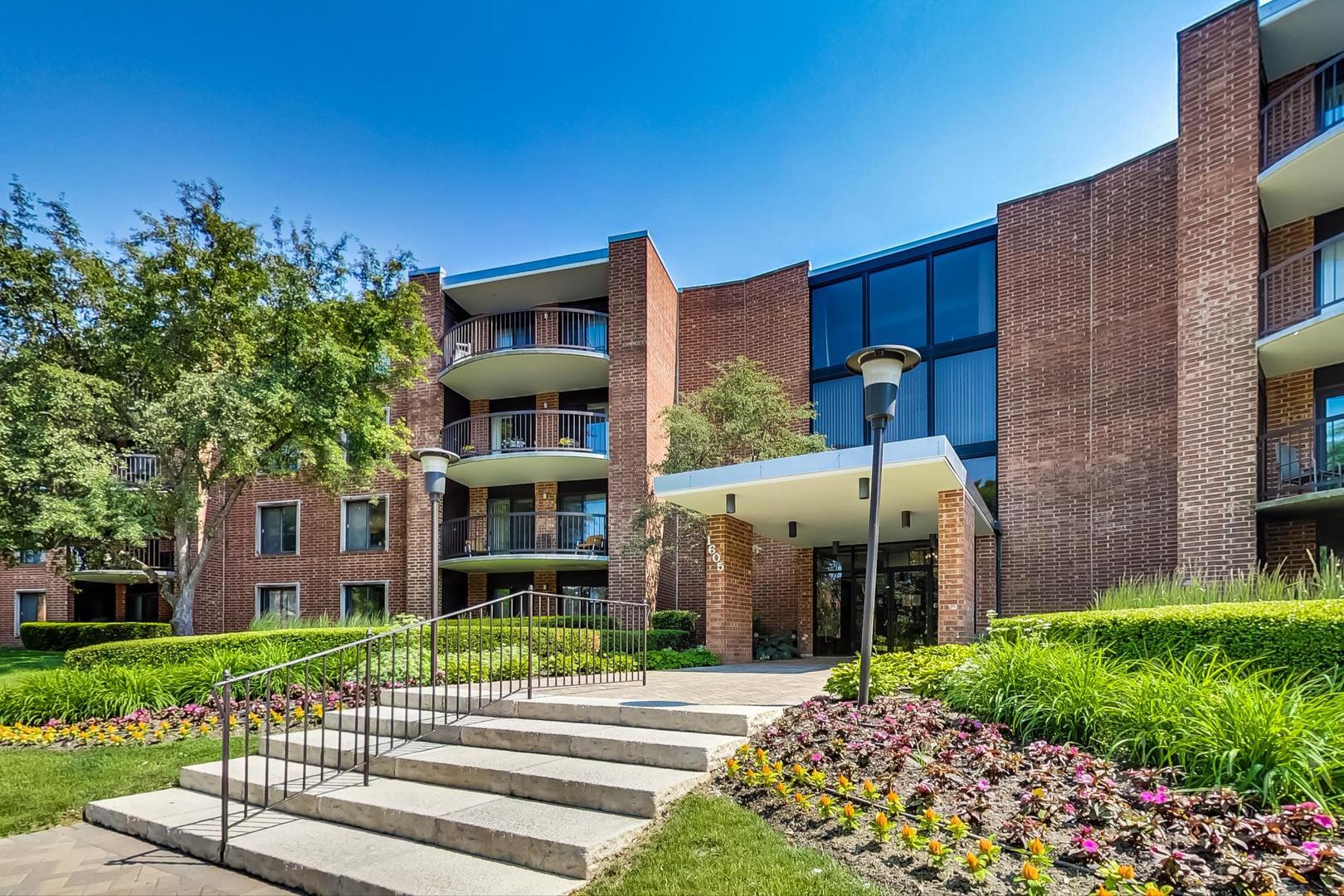 1605 East Central Road, Unit 111B Arlington Heights, IL 60005 - Photo 26 of 26 a front view of a building with garden