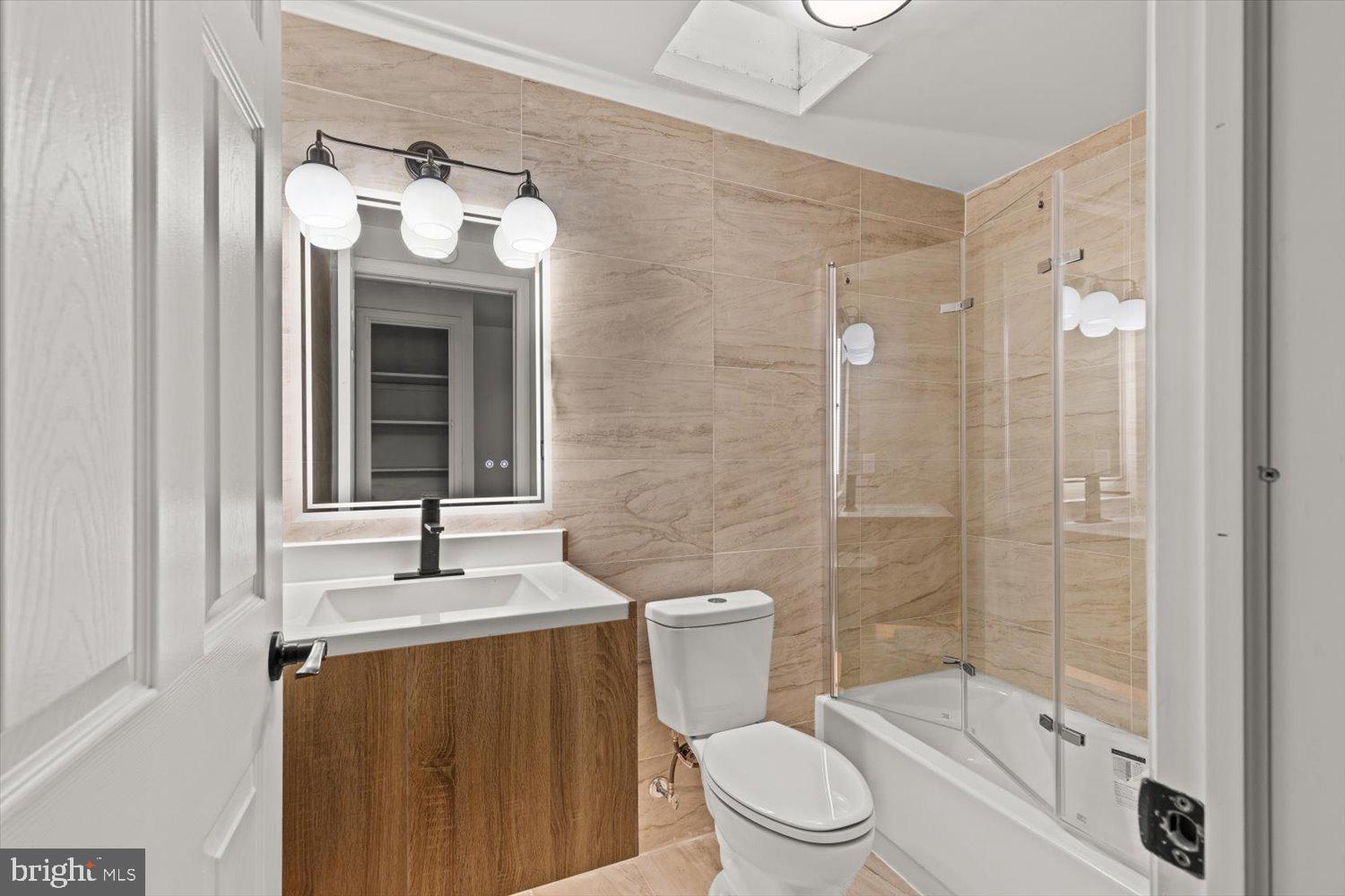414 Fairview Avenue Lancaster, PA 17603 - Photo 13 of 29 a bathroom with a toilet sink vanity granite and shower