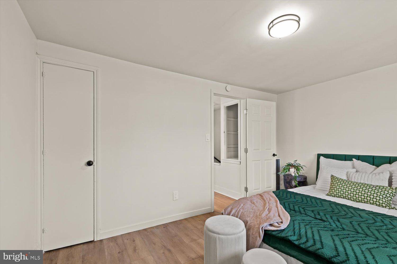 414 Fairview Avenue Lancaster, PA 17603 - Photo 16 of 29 a room with a bed and wooden floor