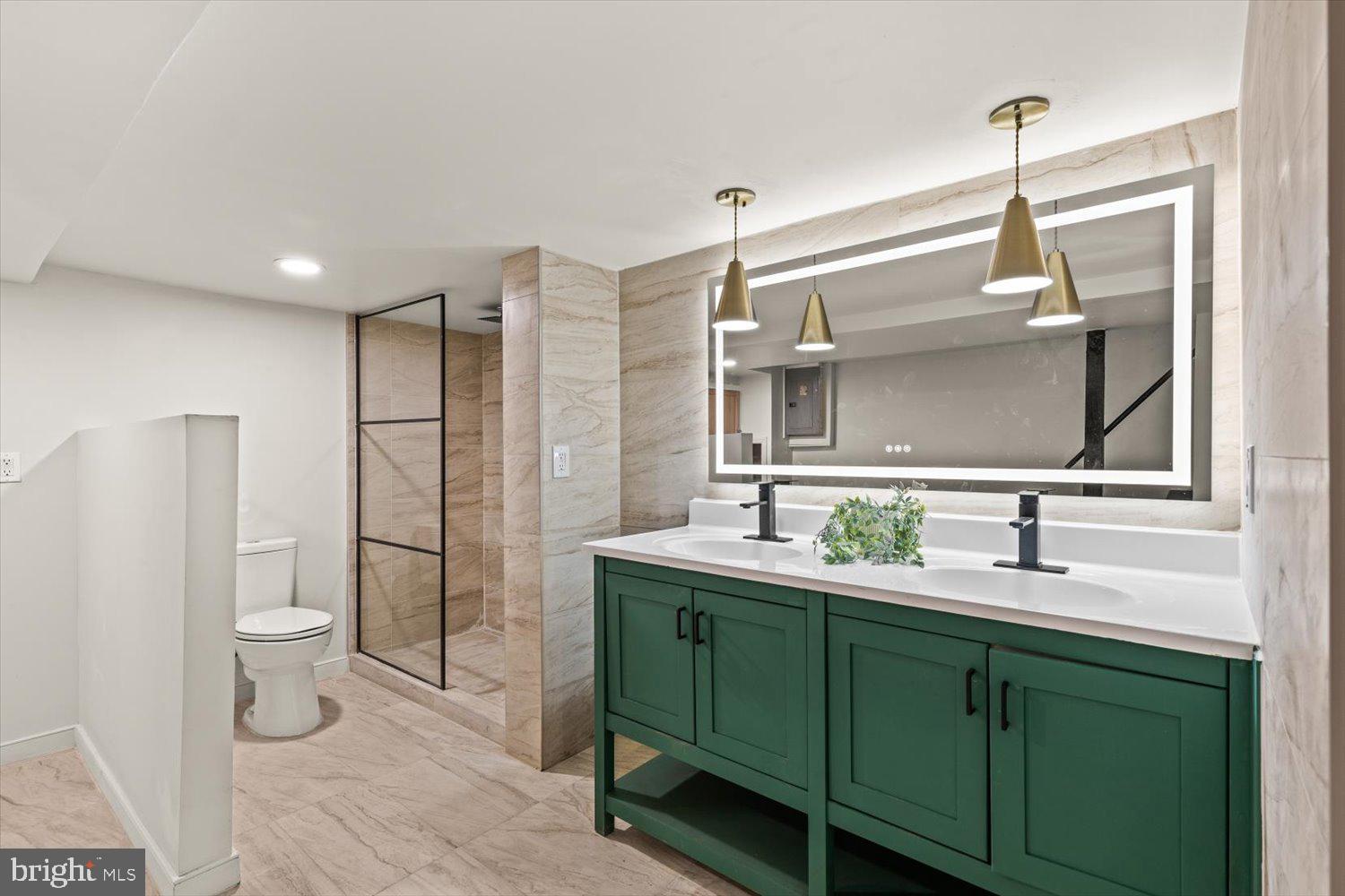 414 Fairview Avenue Lancaster, PA 17603 - Photo 22 of 29 a bathroom with a double vanity sink toilet and mirror
