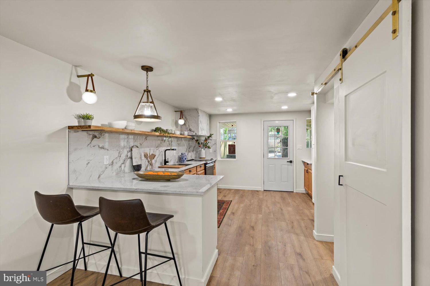 414 Fairview Avenue Lancaster, PA 17603 - Photo 7 of 29 a kitchen with kitchen island a counter top space a sink and appliances