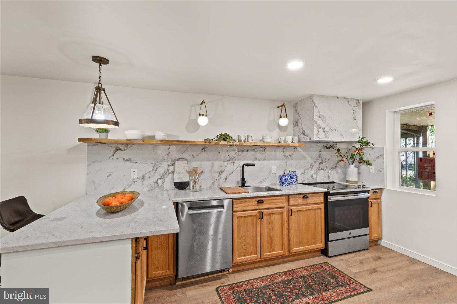 414 Fairview Avenue Lancaster, PA 17603 - Photo 8 of 29 a kitchen with stainless steel appliances granite countertop a sink and cabinets