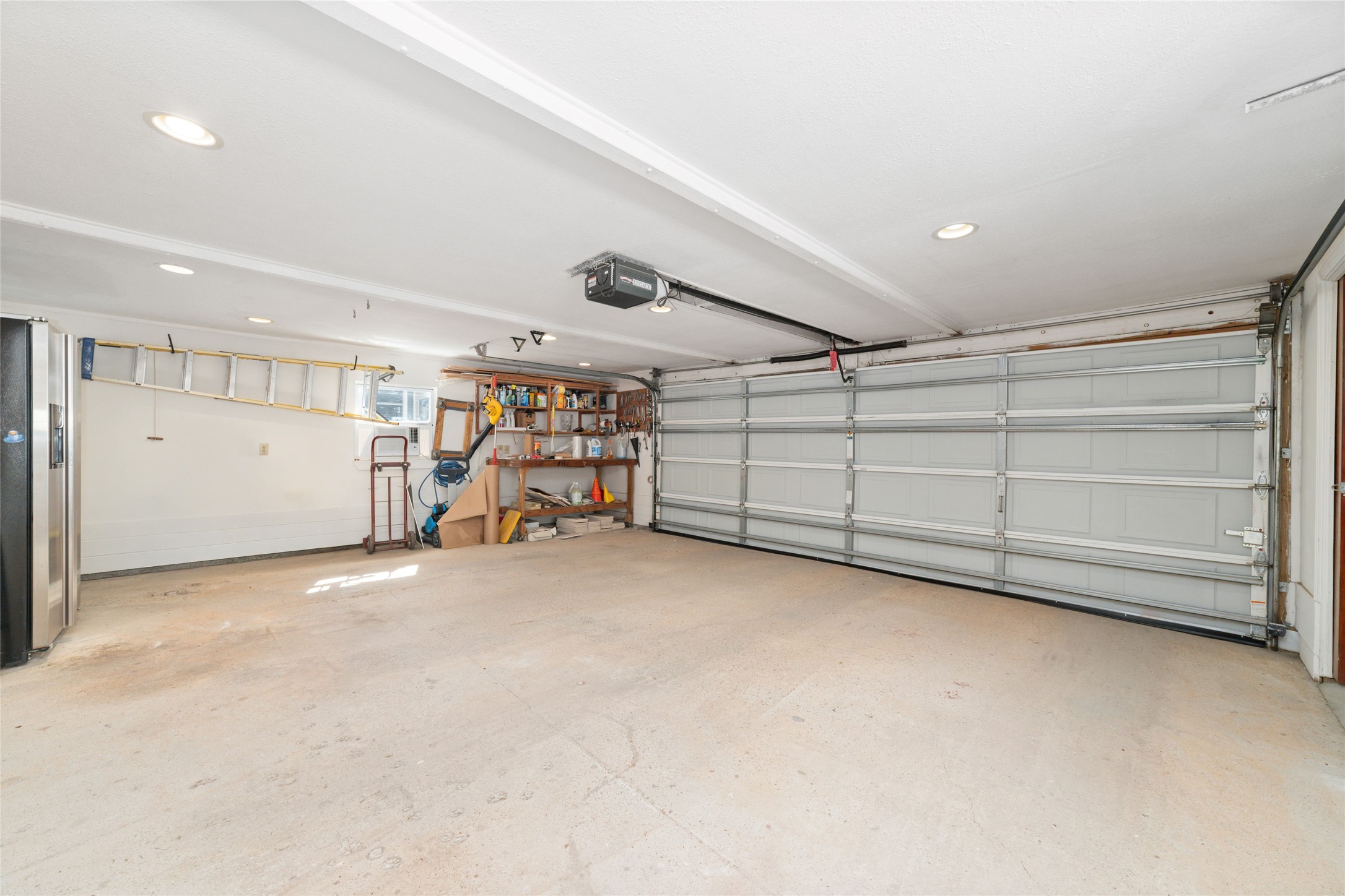 1613 California Street Houston, TX 77006 - Photo 40 of 50 Designed with both functionality and flexibility in mind, the oversized garage provides generous space for parking, storage, workshop needs, or future creative pursuits, complementing the thoughtful utility found throughout the property.