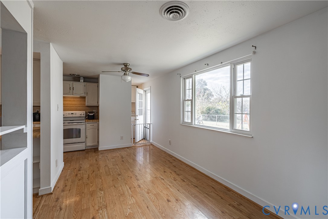 6310 Dahlia Road Mechanicsville, VA 23111 - Photo 20 of 38 wooden floor in an empty room with a window