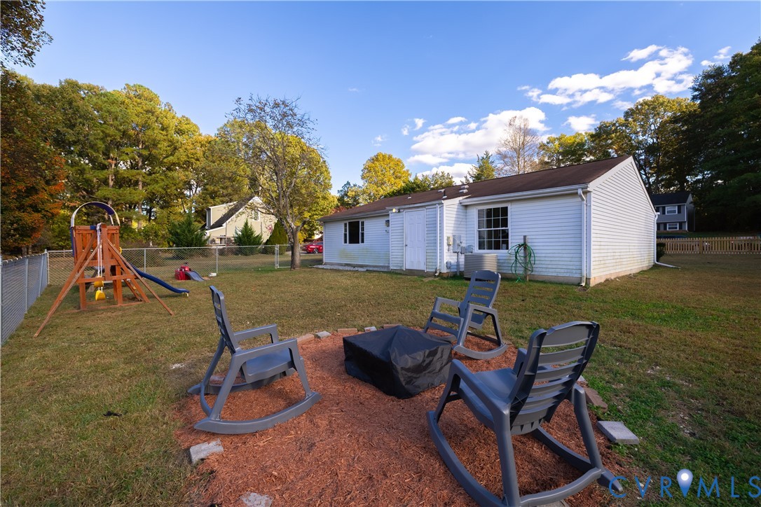 6310 Dahlia Road Mechanicsville, VA 23111 - Photo 22 of 38 a view of a house with backyard porch and sitting area
