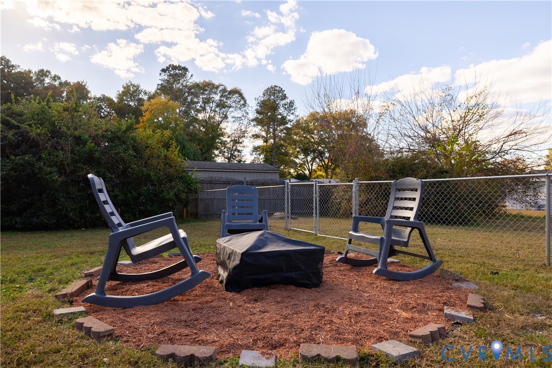 6310 Dahlia Road Mechanicsville, VA 23111 - Photo 23 of 38 a roof deck with table and chairs and potted plants
