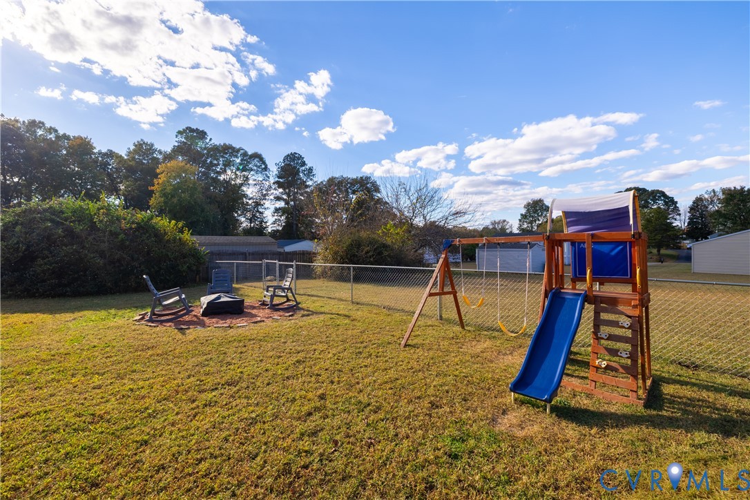 6310 Dahlia Road Mechanicsville, VA 23111 - Photo 25 of 38 a view of a swimming pool with a slide and a basket