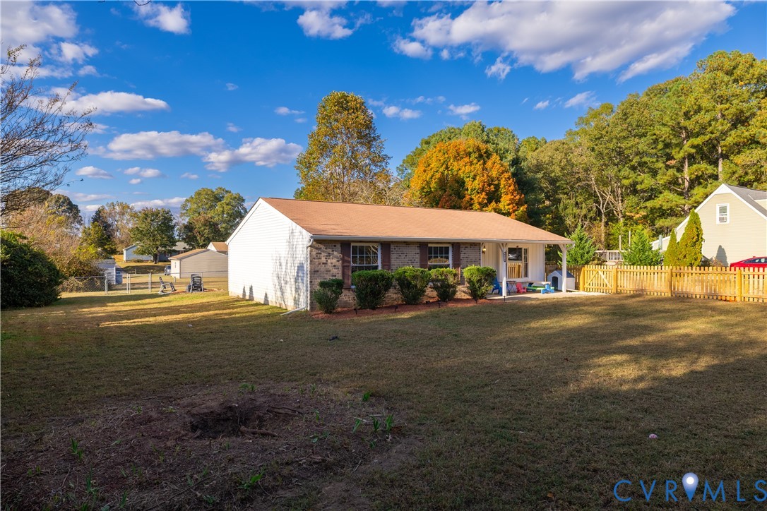 6310 Dahlia Road Mechanicsville, VA 23111 - Photo 36 of 38 a front view of a house with yard