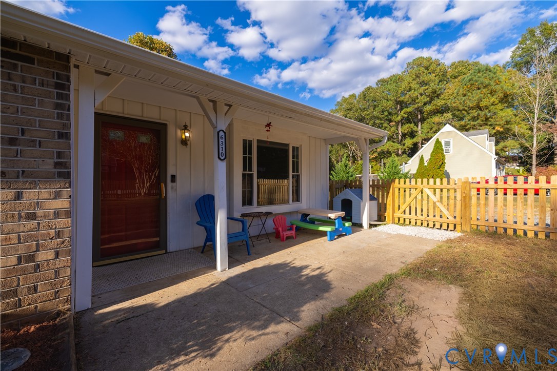 6310 Dahlia Road Mechanicsville, VA 23111 - Photo 37 of 38 a view of a house with a porch