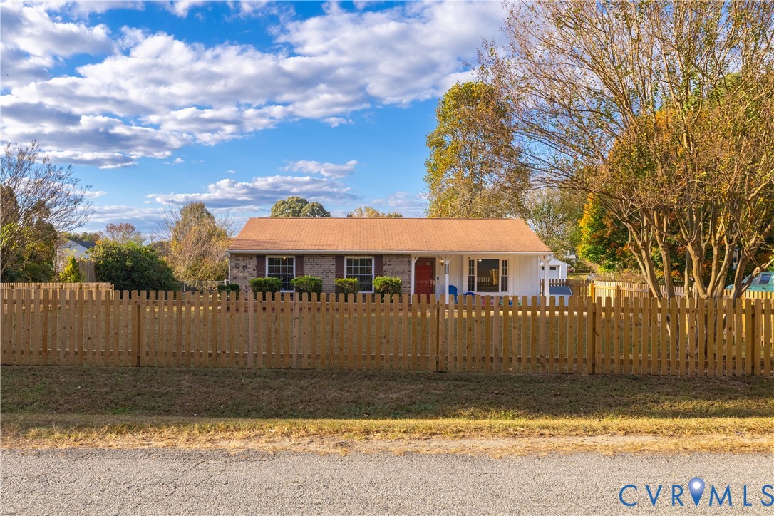6310 Dahlia Road Mechanicsville, VA 23111 - Photo 38 of 38 a view of a house with backyard and trees