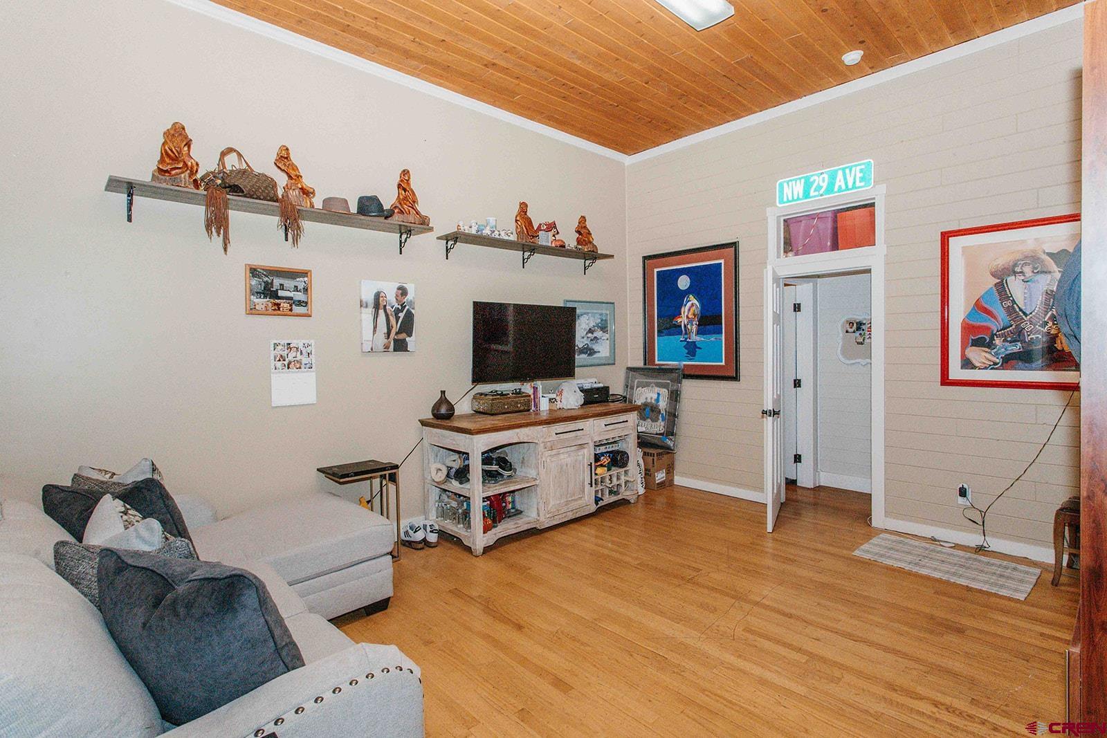 807 Main Street, Unit 3 Ouray, CO 81427 - Photo 13 of 26 a living room with furniture and flat screen tv