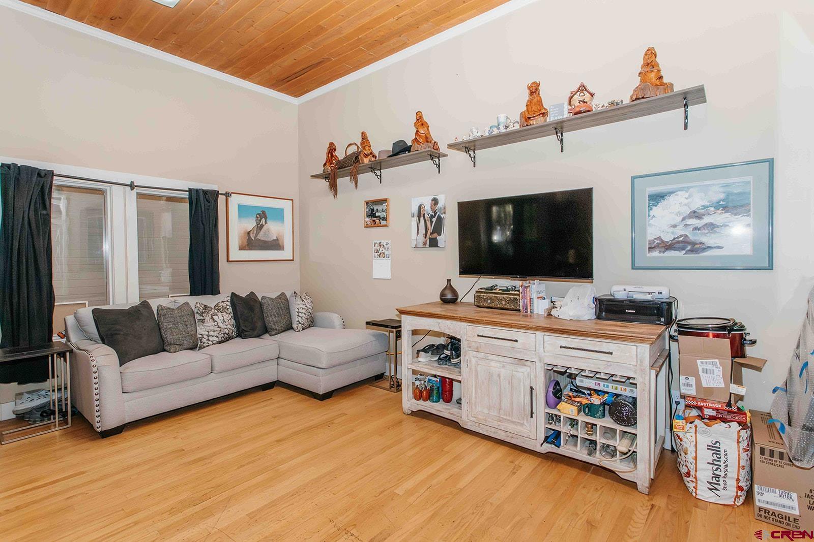 807 Main Street, Unit 3 Ouray, CO 81427 - Photo 15 of 26 a living room with furniture and a flat screen tv