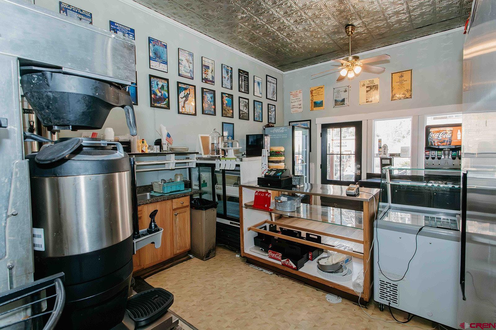 807 Main Street, Unit 3 Ouray, CO 81427 - Photo 19 of 26 a kitchen with stainless steel appliances granite countertop a stove and a refrigerator
