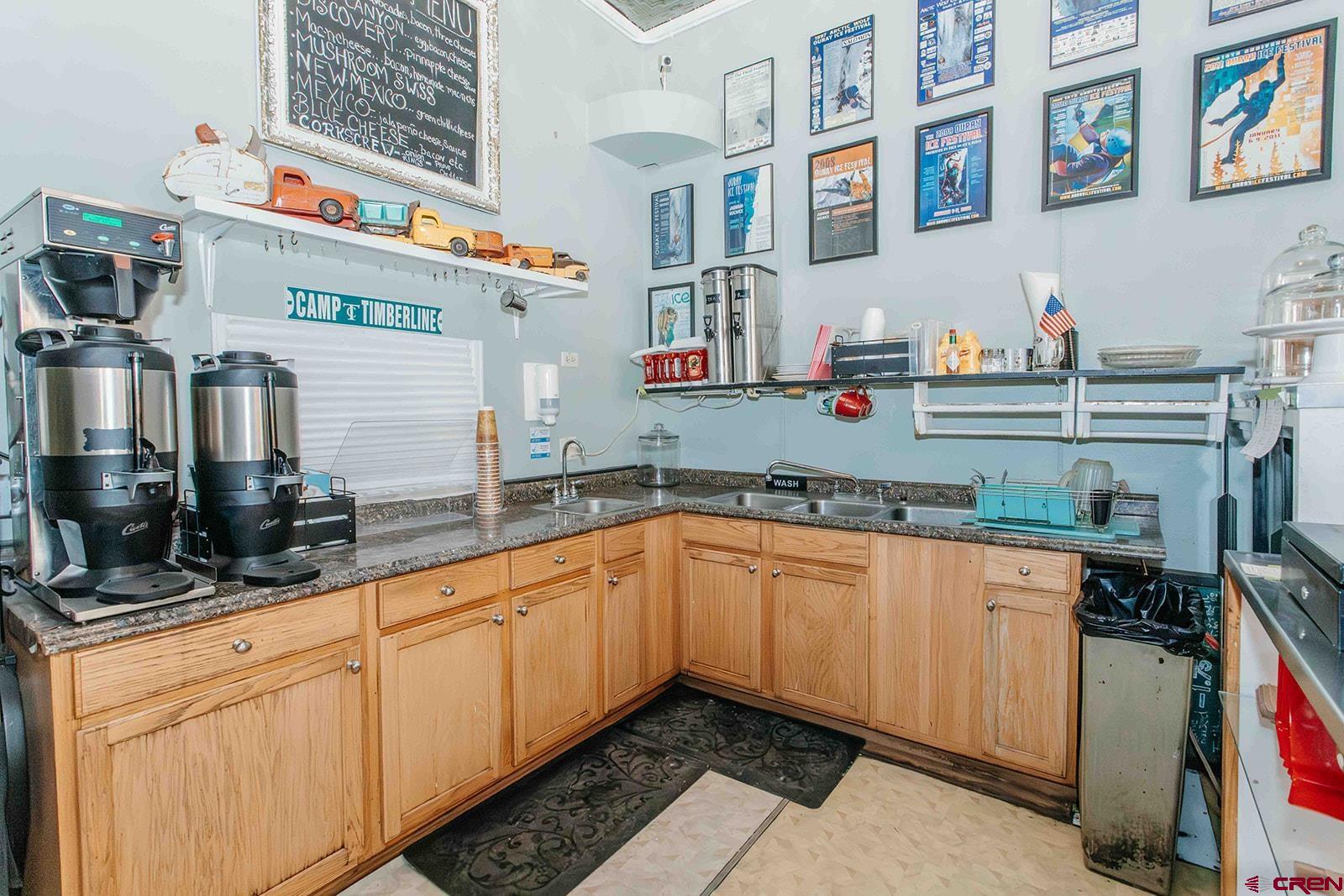 807 Main Street, Unit 3 Ouray, CO 81427 - Photo 20 of 26 a kitchen with stainless steel appliances granite countertop a sink and cabinets
