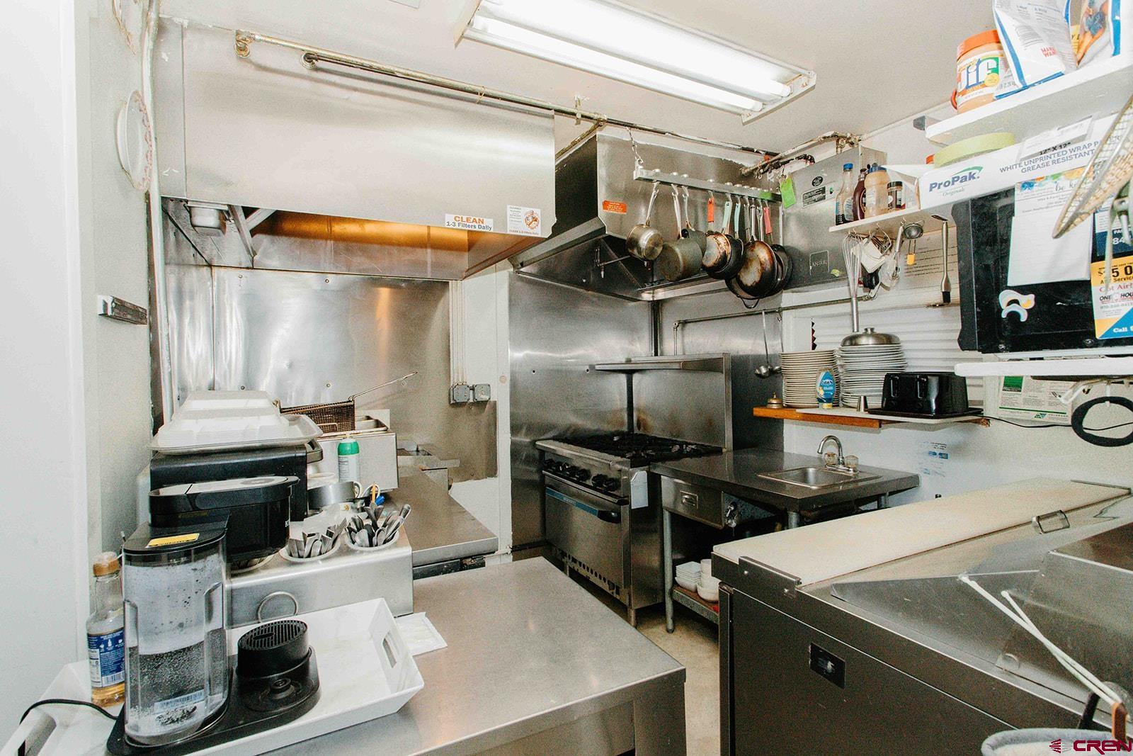 807 Main Street, Unit 3 Ouray, CO 81427 - Photo 9 of 26 a kitchen with stainless steel appliances a stove and a refrigerator
