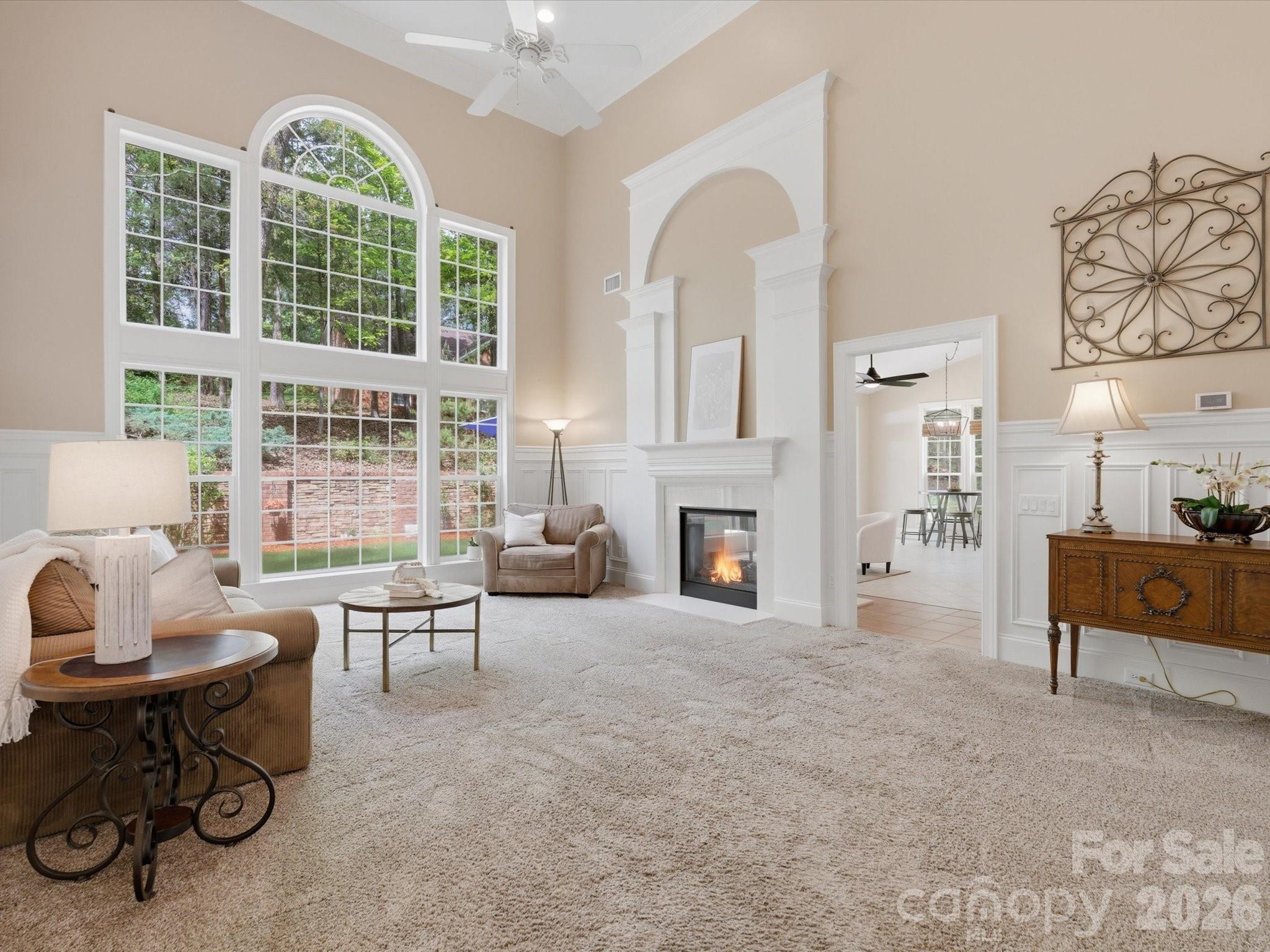 809 Savile Lane Fort Mill, SC 29715 - Photo 11 of 48 a living room with furniture a fireplace and a table