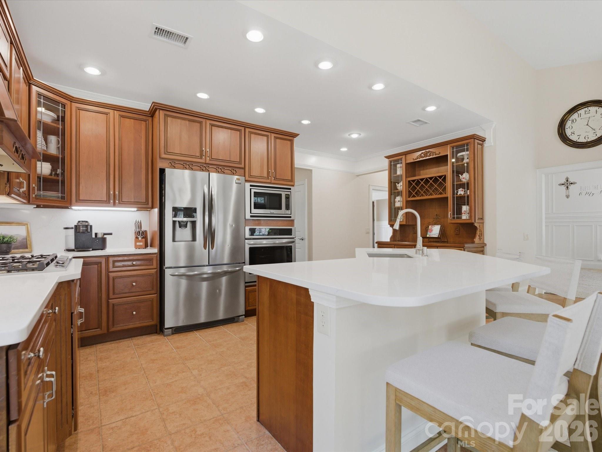 809 Savile Lane Fort Mill, SC 29715 - Photo 17 of 48 a kitchen with refrigerator and cabinets