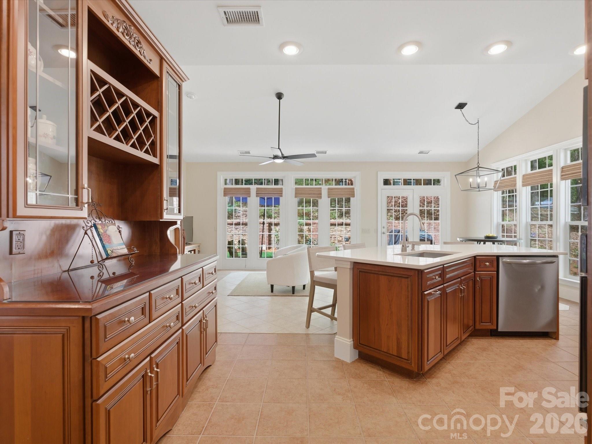 809 Savile Lane Fort Mill, SC 29715 - Photo 19 of 48 a kitchen with stainless steel appliances granite countertop a sink and a stove