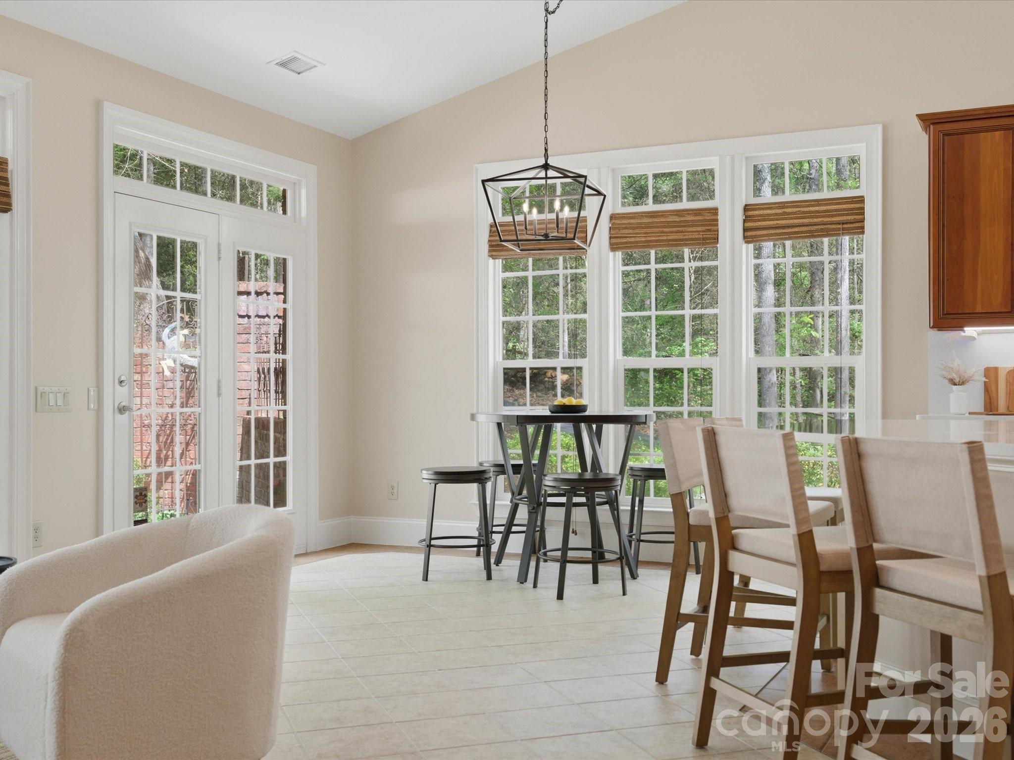 809 Savile Lane Fort Mill, SC 29715 - Photo 20 of 48 a view of a dining room with furniture window and outside view