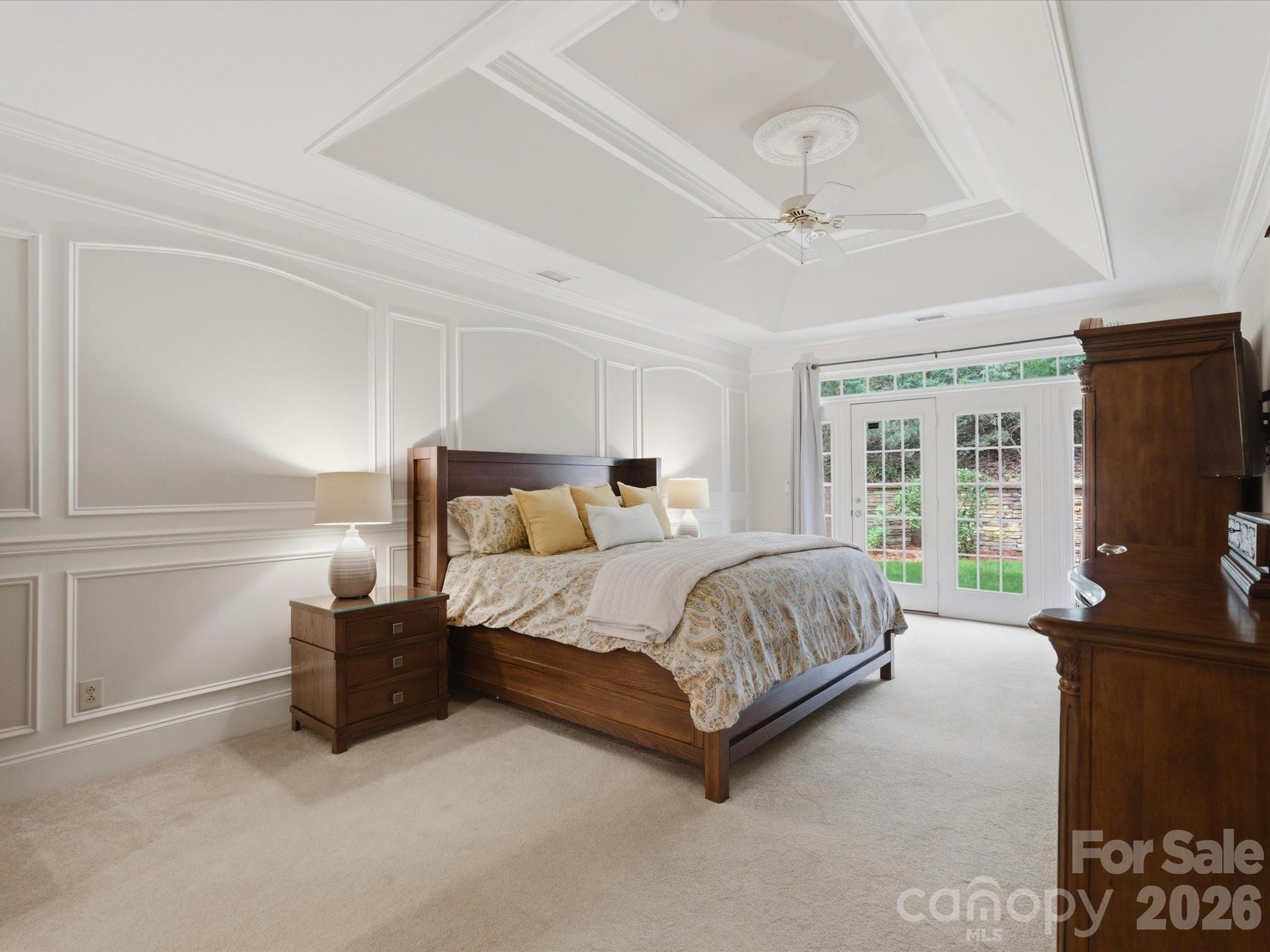 809 Savile Lane Fort Mill, SC 29715 - Photo 25 of 48 a spacious bedroom with a bed and large windows