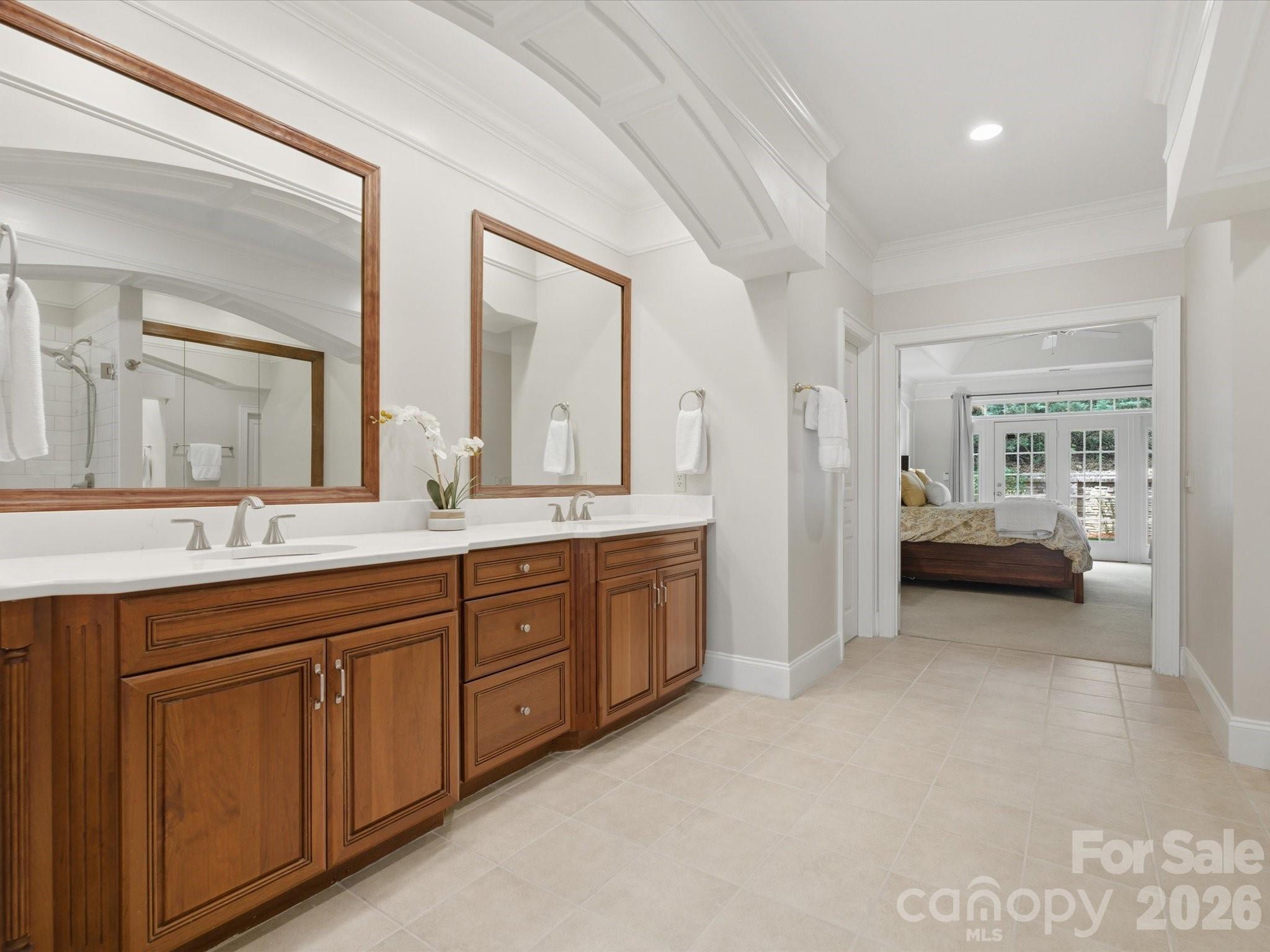 809 Savile Lane Fort Mill, SC 29715 - Photo 26 of 48 a spacious en suite bathroom with a double vanity sink and a mirror