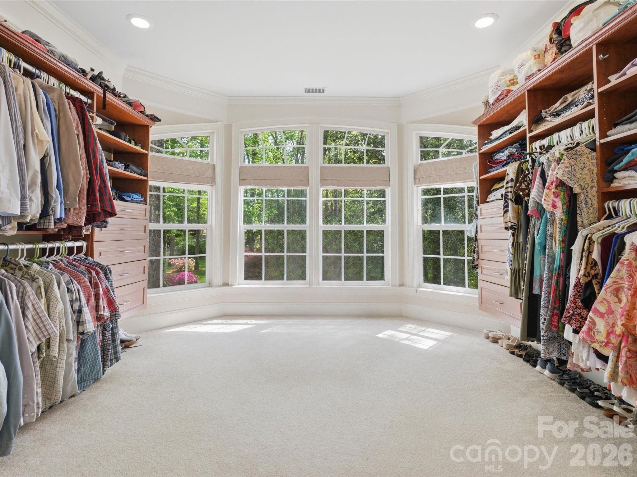 809 Savile Lane Fort Mill, SC 29715 - Photo 28 of 48 a view of a bedroom with a window and a walk in closet