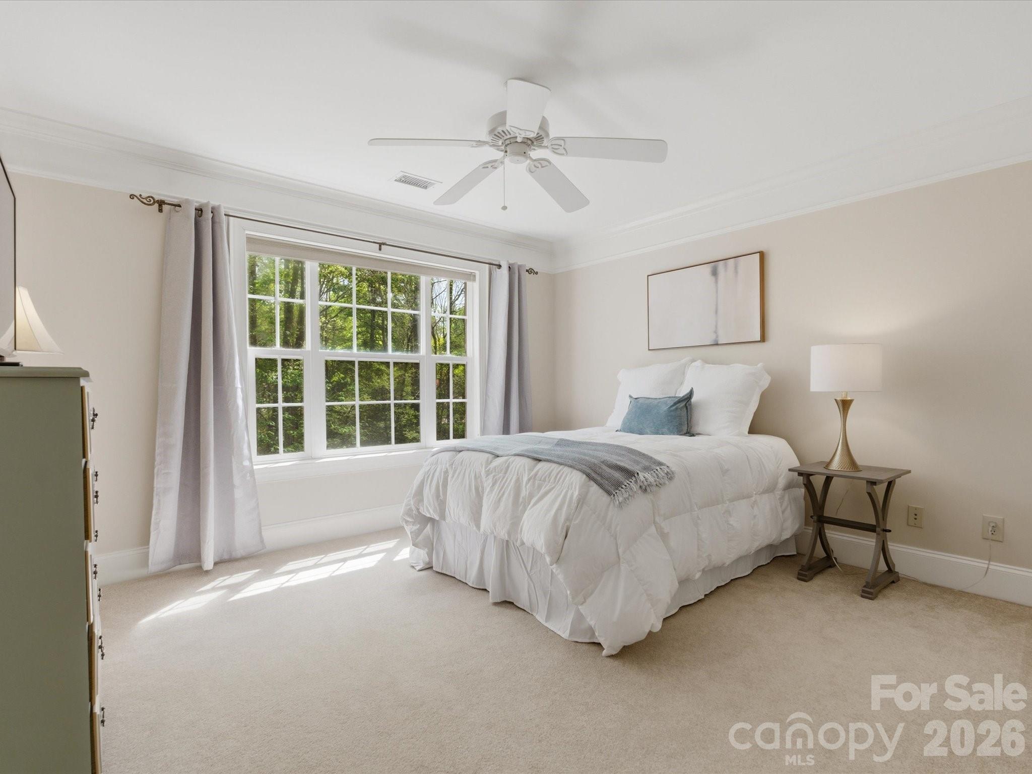 809 Savile Lane Fort Mill, SC 29715 - Photo 38 of 48 a spacious bedroom with a bed and a window