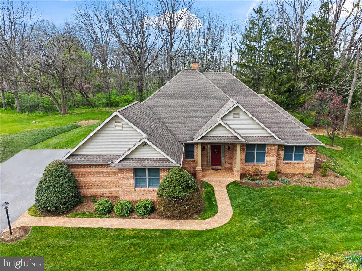 315 Rocherty Road Lebanon, PA 17042 - Photo 1 of 55 Charming brick home with lush greenery.