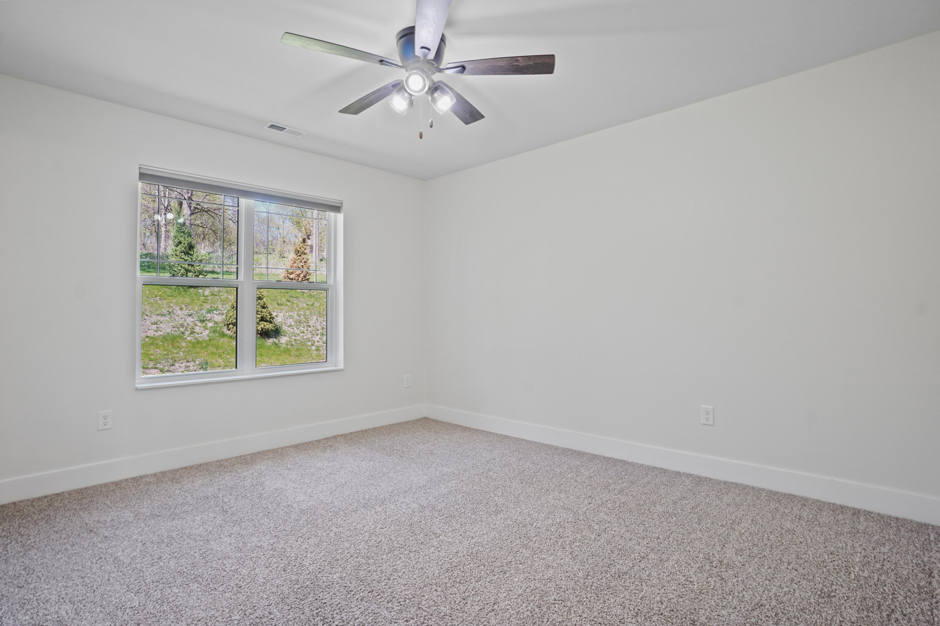 117 Eiche Drive, Unit 2 Slinger, WI 53086 - Photo 14 of 24 Primary Bedroom