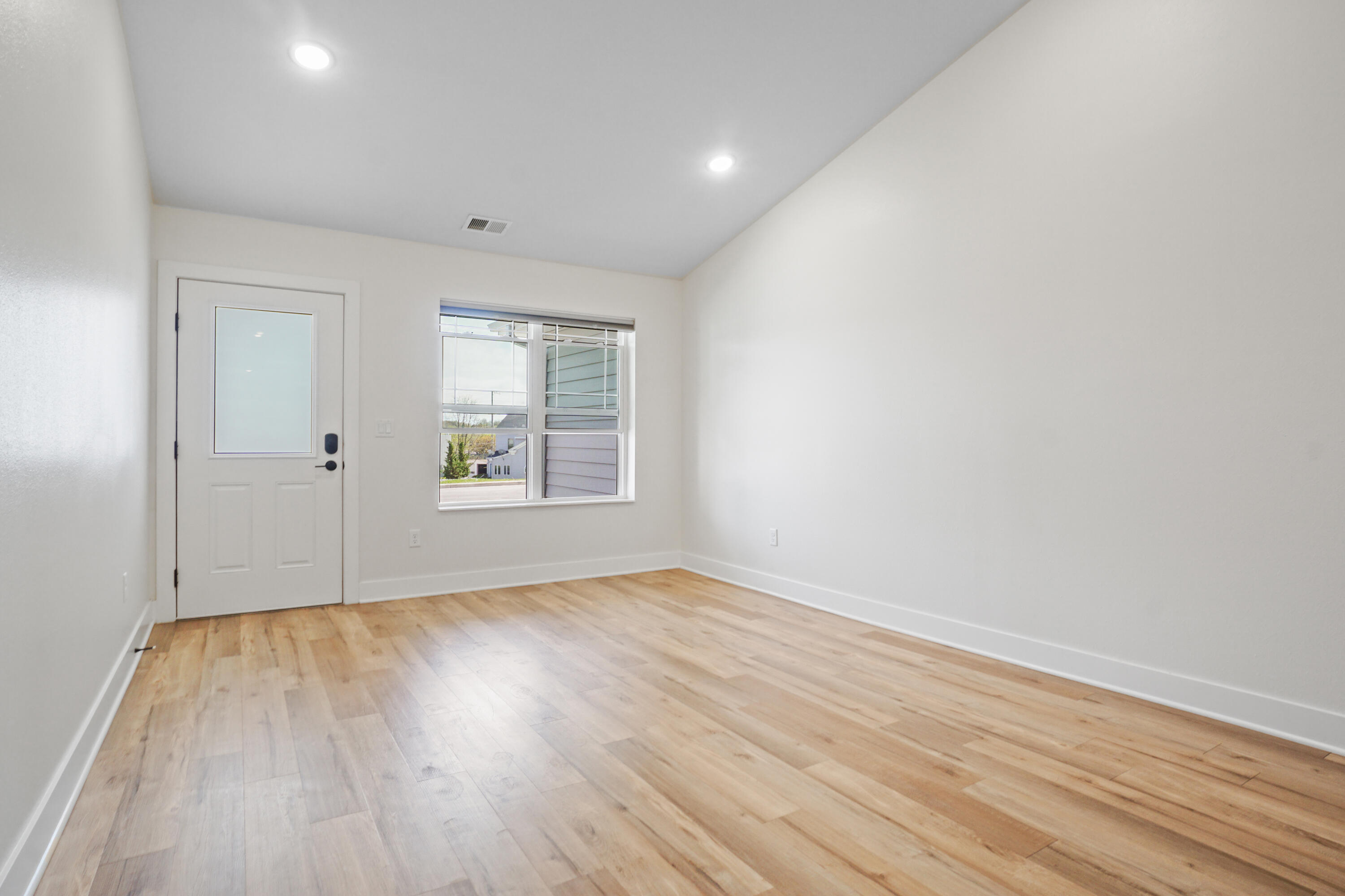 117 Eiche Drive, Unit 2 Slinger, WI 53086 - Photo 6 of 24 Great Room/Dining Area